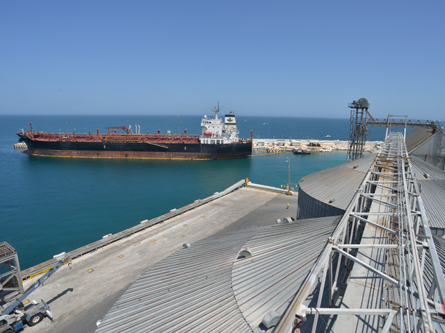 The Grupo Logra grain terminal at Puerto de Progreso, Mexico, offloads 2.1 million metric tons of grain annually, most from U.S. producers. The port also serves oil tankers such as the one docked here. (DTN/The Progressive Farmer photo by Jim Patrico)